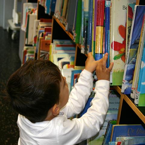 young boy in library